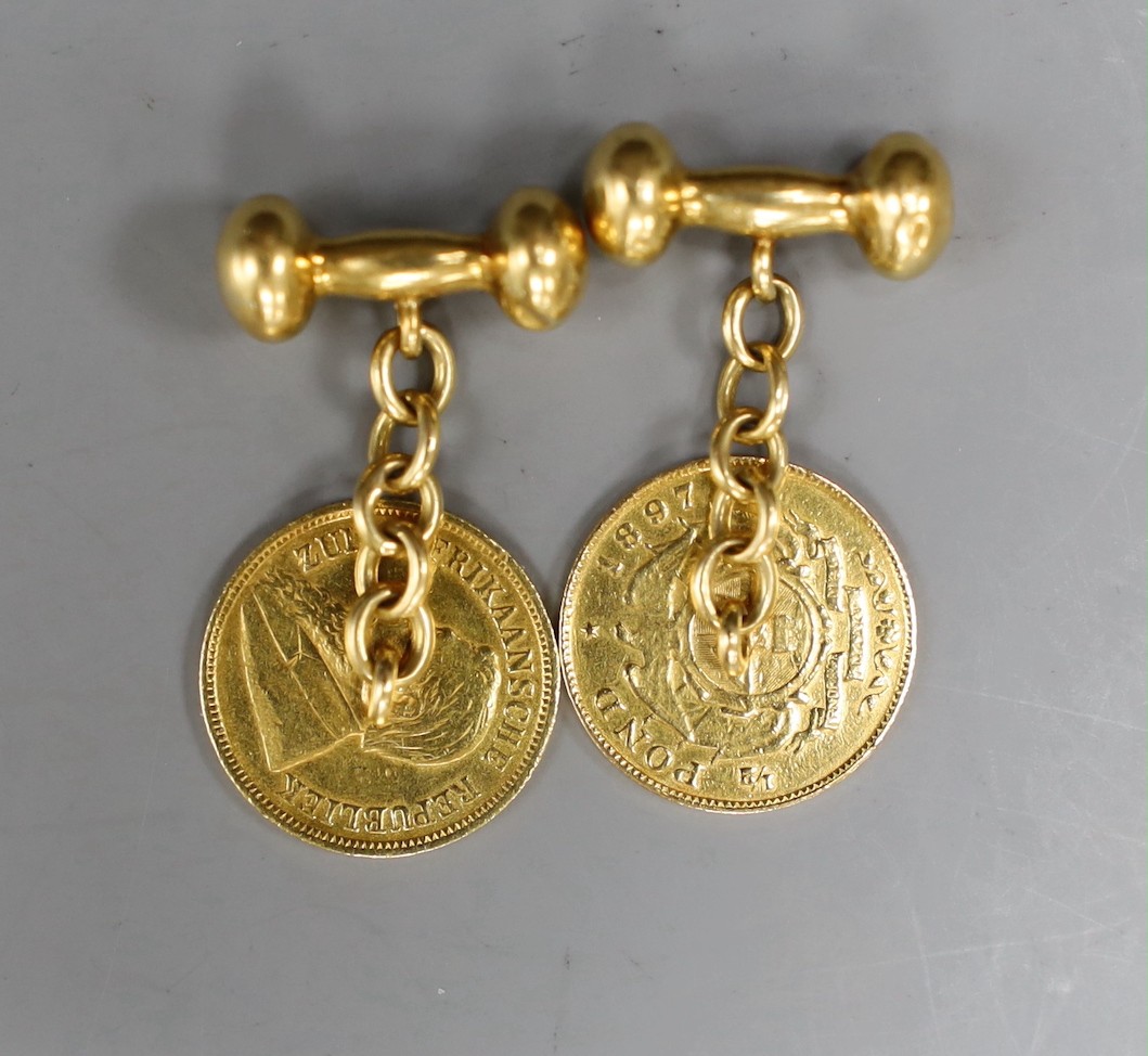 A pair of yellow metal cufflinks, each mounted with a South African 1897 gold pond coin